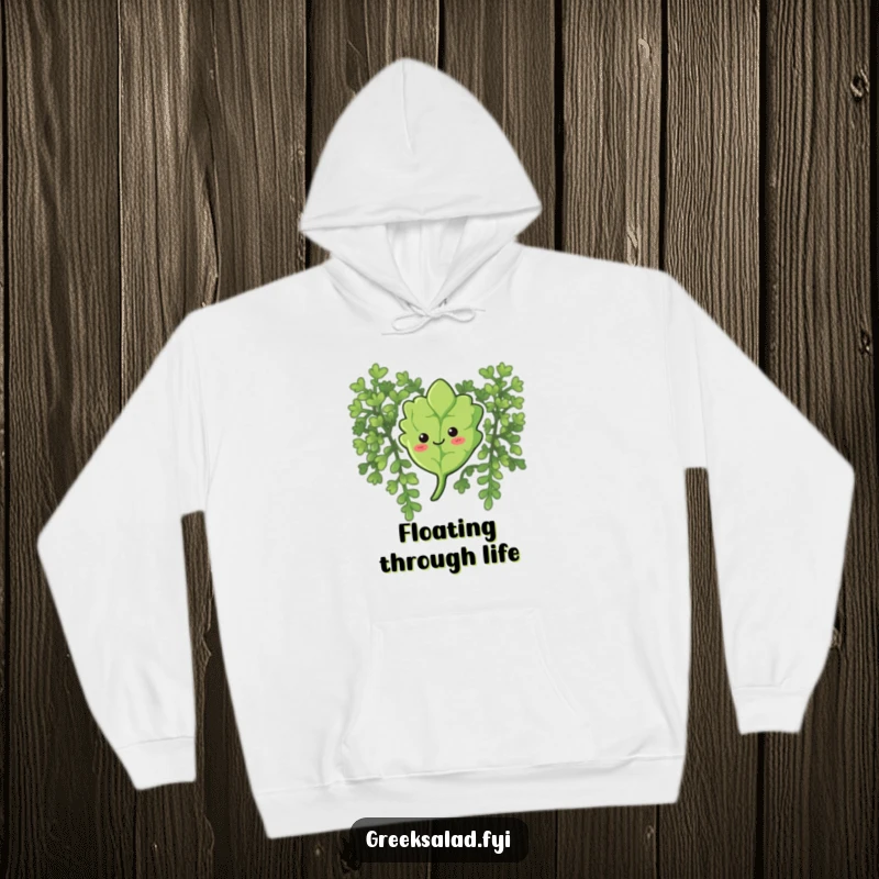 Funny hoodie depicting a curious oregano leaf with a smile, floating gently down, perfect for relaxed comfort.